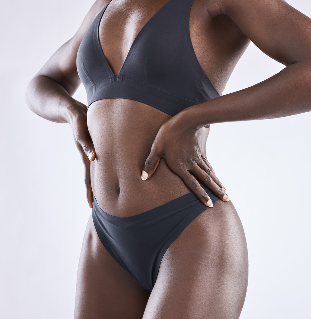 Woman standing with hands on hips